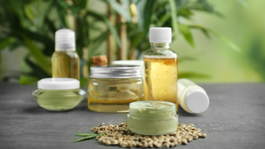 Hemp Cosmetic Products and Seeds on Grey Background